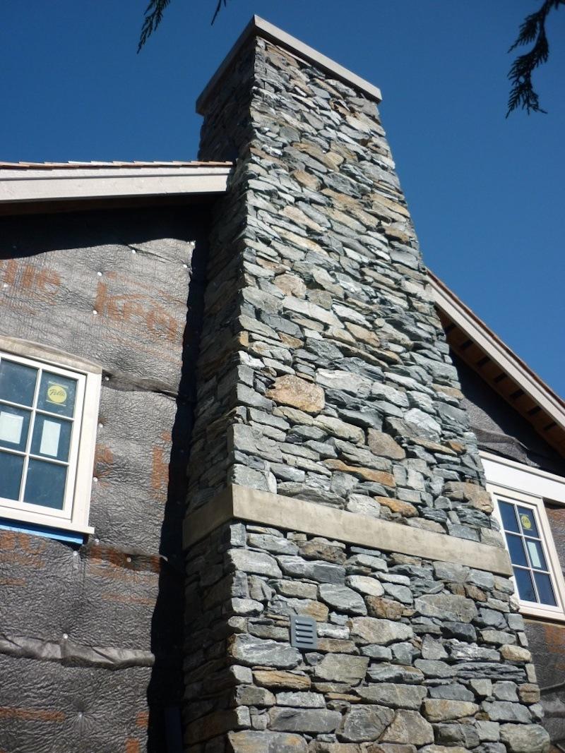 Picture of a full bed chimney made with beach stone